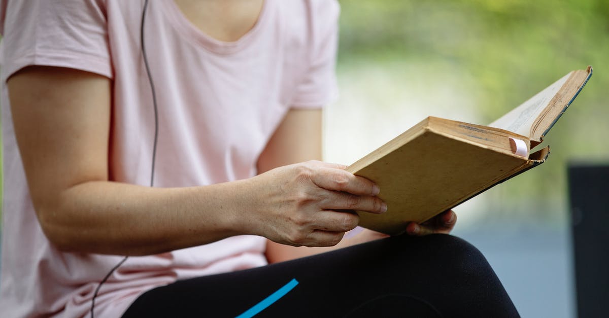 Why won't GTA won't save my progress in story mode? - Crop anonymous woman in casual clothes sitting in park while reading book in summer day Why won't GTA won't save my progress in story mode? - Crop anonymous woman in casual clothes sitting in park while reading book in summer day
