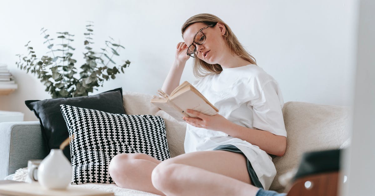 Why won't GTA won't save my progress in story mode? - Serious female in eyeglasses sitting on comfortable couch and reading interesting book in living room Why won't GTA won't save my progress in story mode? - Serious female in eyeglasses sitting on comfortable couch and reading interesting book in living room