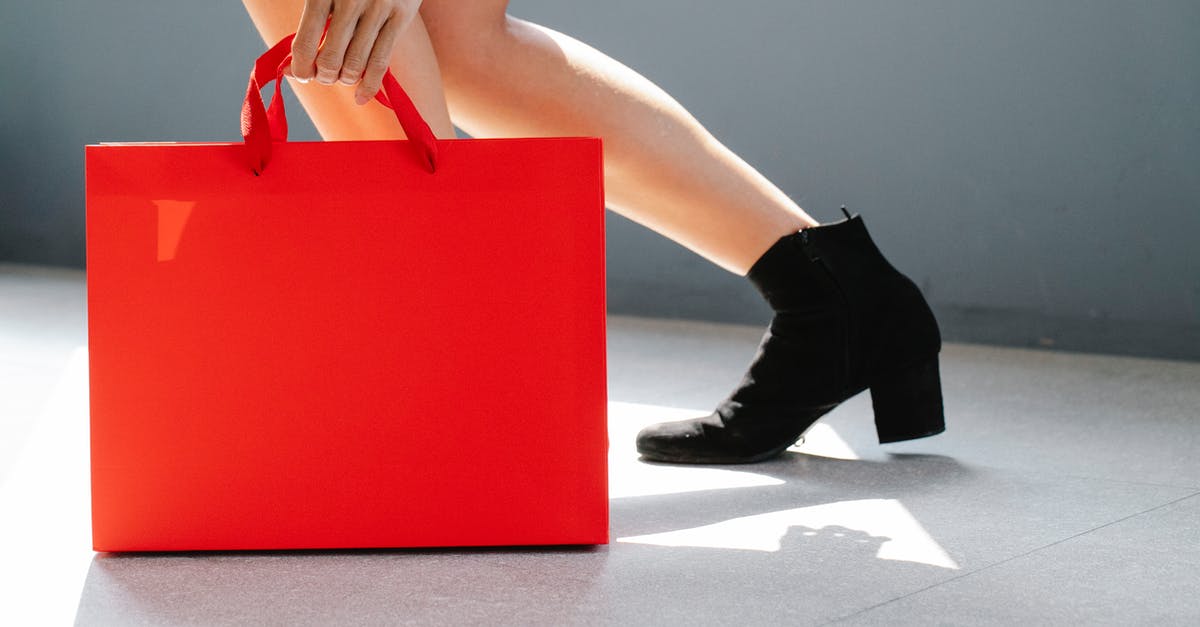 Why won't my Xbox 360 boot - Side view of crop unrecognizable female in trendy boots holding red paper bag while standing on street on sunny day after shopping Why won't my Xbox 360 boot - Side view of crop unrecognizable female in trendy boots holding red paper bag while standing on street on sunny day after shopping