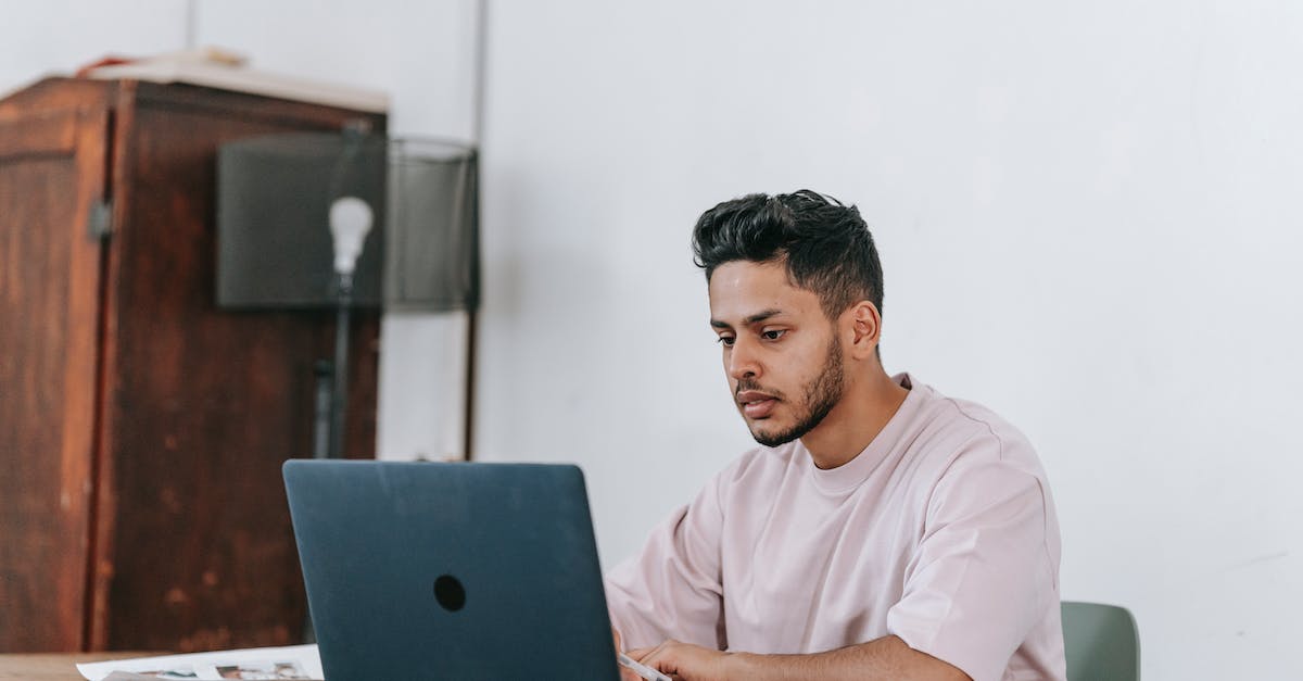 Why won't the Eden Project monument unlock? - Serious Hispanic freelancer working on laptop at table in house Why won't the Eden Project monument unlock? - Serious Hispanic freelancer working on laptop at table in house