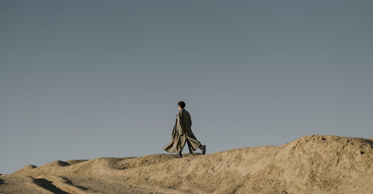 Why won't the Sloan quarry workers move back into Quarry Junction? - Man in Black Jacket Walking on Brown Sand Why won't the Sloan quarry workers move back into Quarry Junction? - Man in Black Jacket Walking on Brown Sand