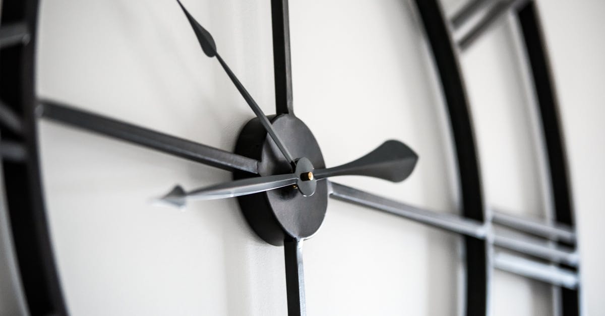 Why won't the time show at the Island? - Modern clock on white wall