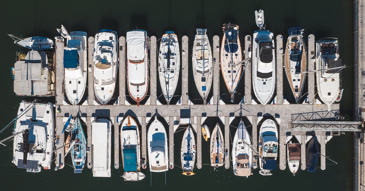 Why won't this dock produce grain? - White and Blue Boats on Body of Water Why won't this dock produce grain? - White and Blue Boats on Body of Water