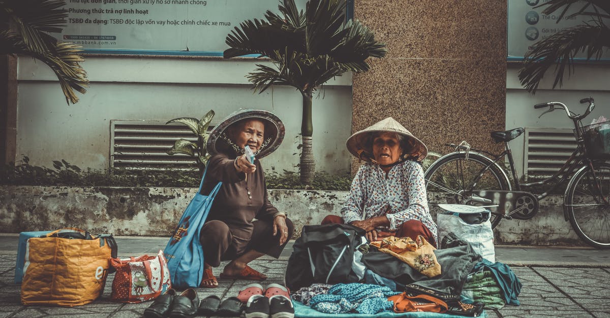 Why won't vendors restock? [duplicate] - Two Women Sitting on the Sidewalk