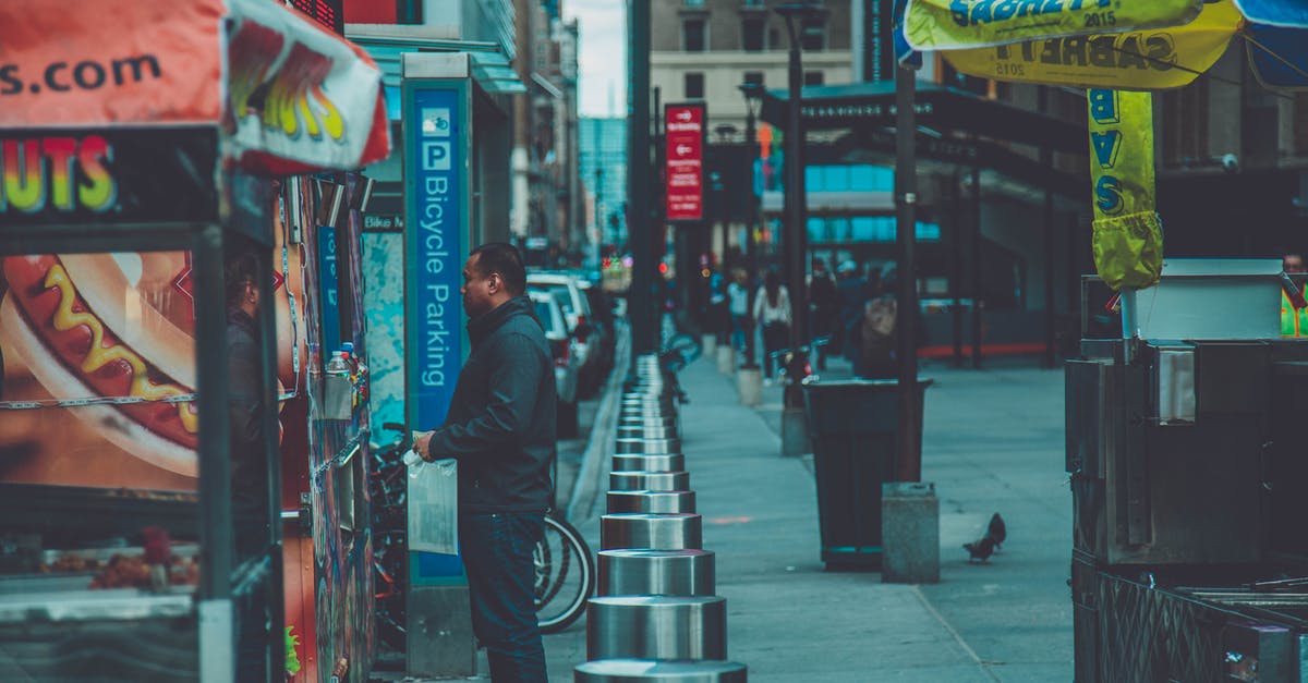 Why won't vendors restock? [duplicate] - Man Standing in Front of Food Stall