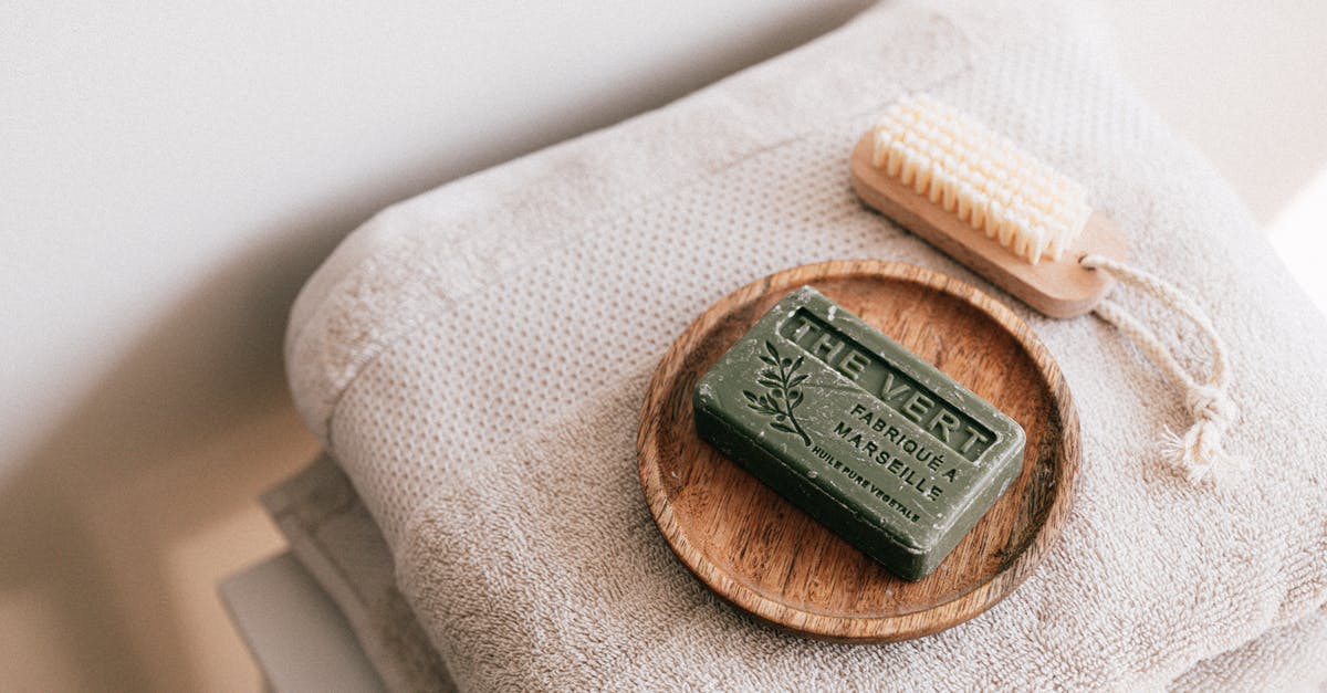 Why would I want to rub my friend's faces? - Natural soap and brush on folded towels Why would I want to rub my friend's faces? - Natural soap and brush on folded towels