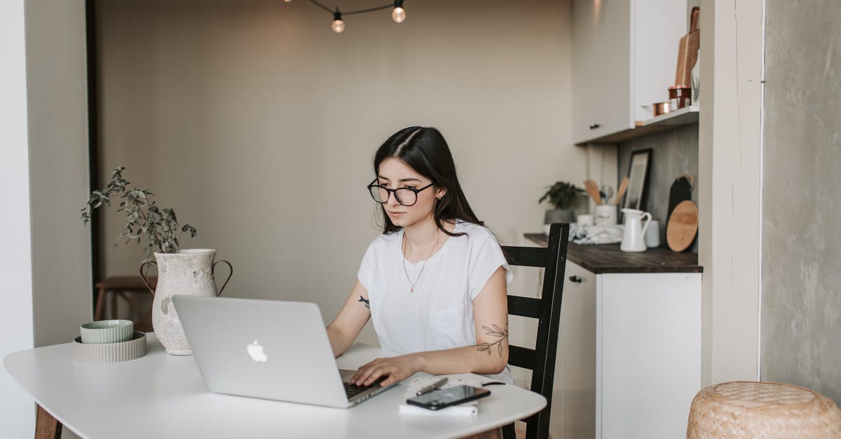 Wii remotes won't sync to Wii - Focused young businesswoman using laptop at home Wii remotes won't sync to Wii - Focused young businesswoman using laptop at home