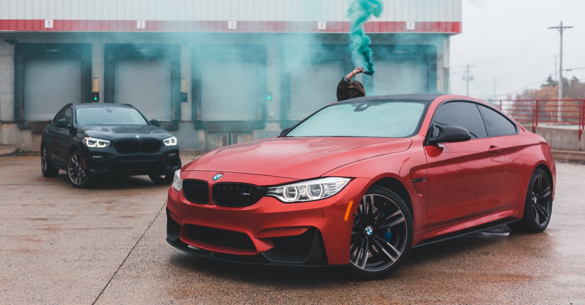 Will a flash grenade blind a hero? - Unrecognizable man with smoking bomb behind car