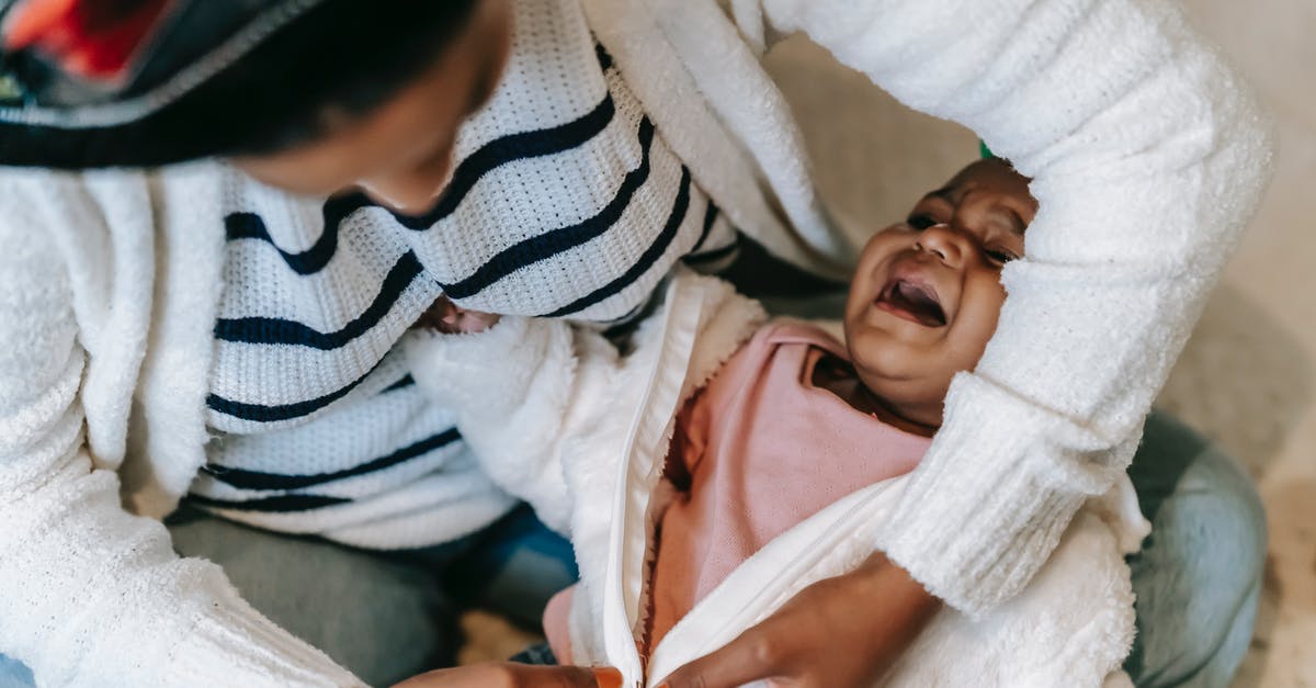 Will changing clothes last minute help me get more souls? - A Mother Changing Her Baby's Clothes