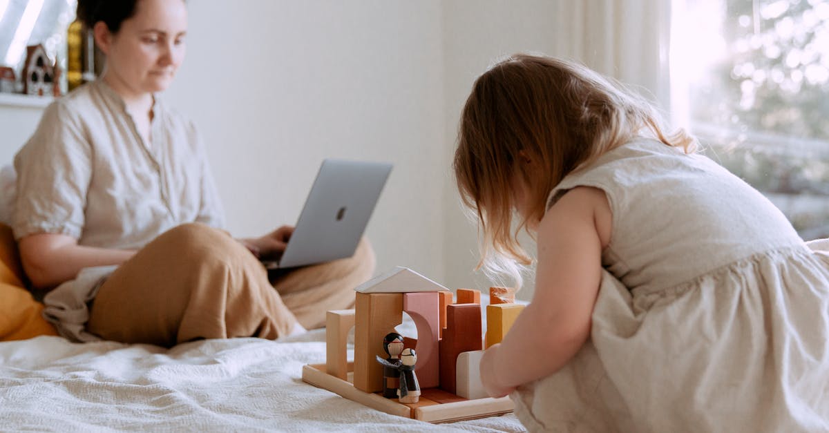Will deleting a Steam game from my PC free up space? - Side view of adorable toddler girl sitting on bed and playing with wooden toys while mother working from home with laptop on knees on sunny morning Will deleting a Steam game from my PC free up space? - Side view of adorable toddler girl sitting on bed and playing with wooden toys while mother working from home with laptop on knees on sunny morning