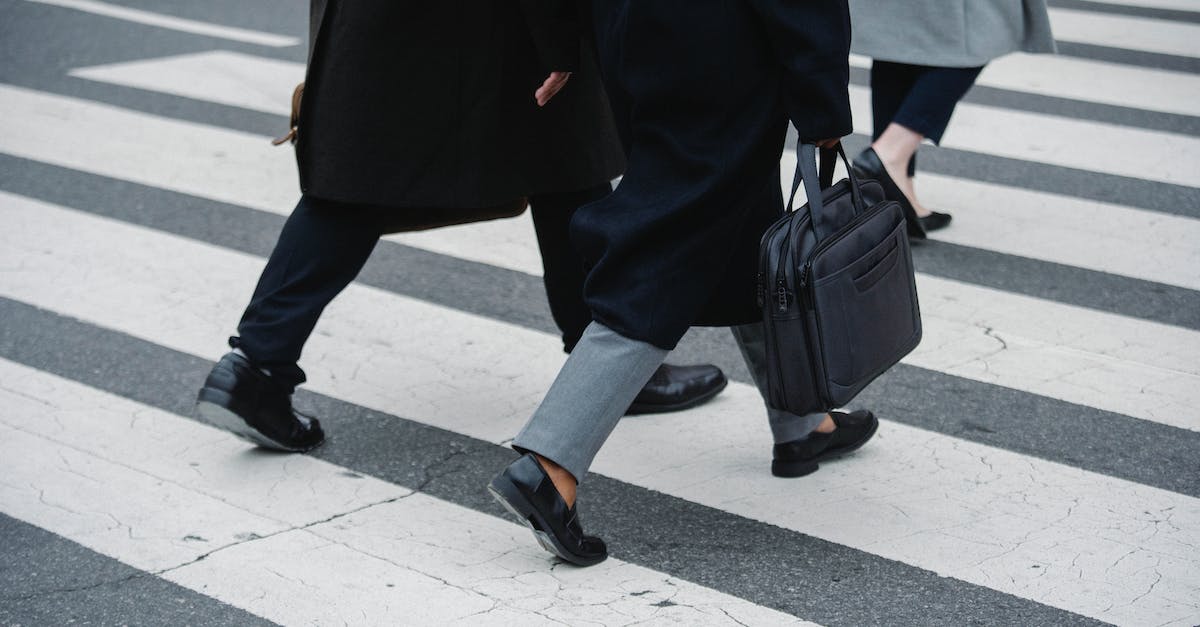 Will Group Finisher Adrenaline Rush impede my other one? - Crop businesspeople strolling on crosswalk in town