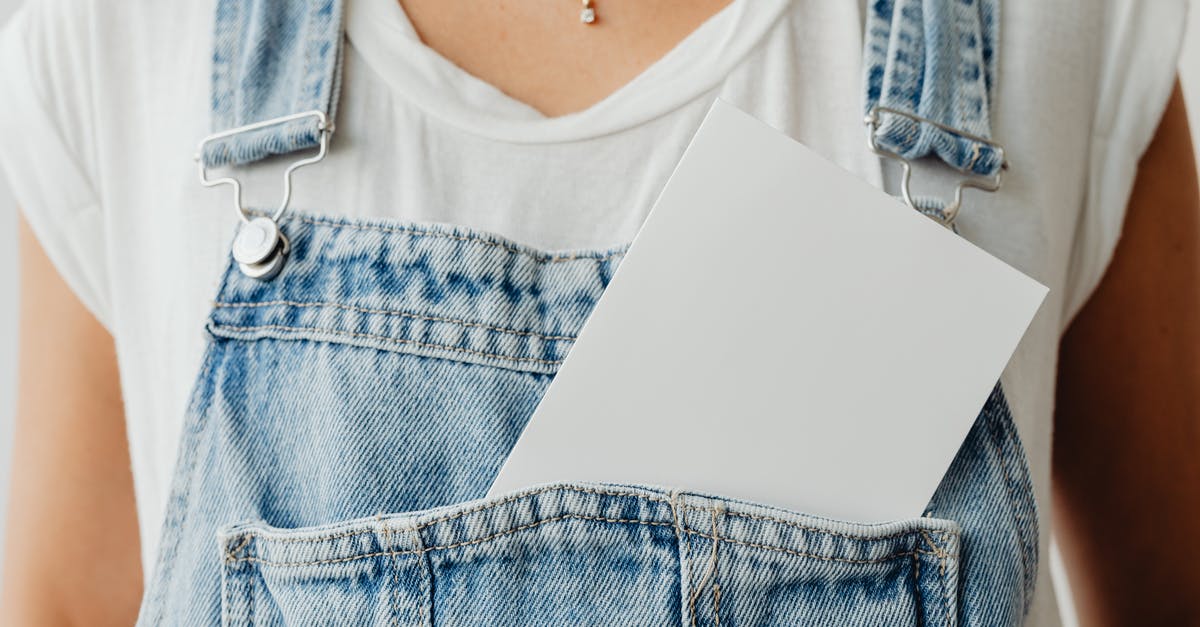 Will having a SIM card plugged into an iPad affect multiplayer gameplay on Minecraft: Pocket Edition? - Photo of a White Card in a Denim Jumper Pocket