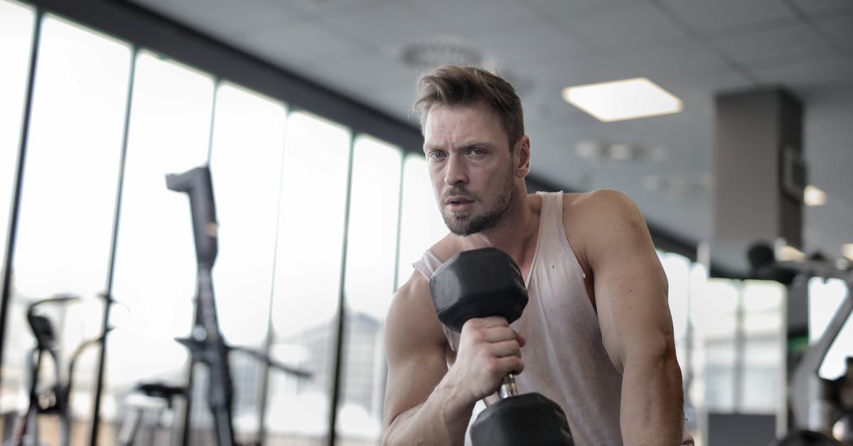 Will higher grade thrusters have any effect if my ship is already below the optimal weight of my current thrusters? - Muscular athletic man exercising with dumbbell in sports center