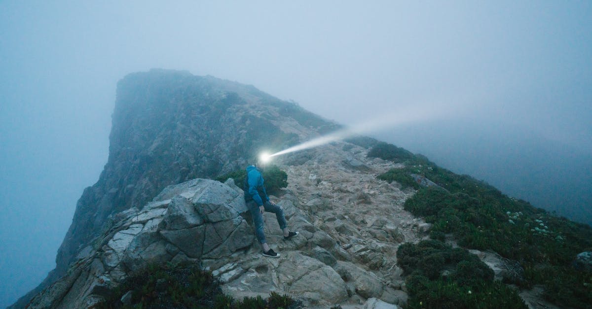 Will I discover space stations through exploring? - Unrecognizable man explorer on cliff Will I discover space stations through exploring? - Unrecognizable man explorer on cliff