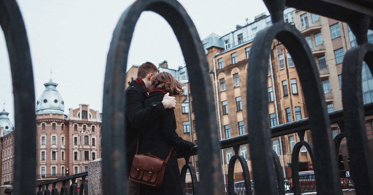 Will I get banned if my Eggs are hatching without walking [closed] - From below of anonymous female and male in warm clothes standing near railing together and hugging in cold weather
