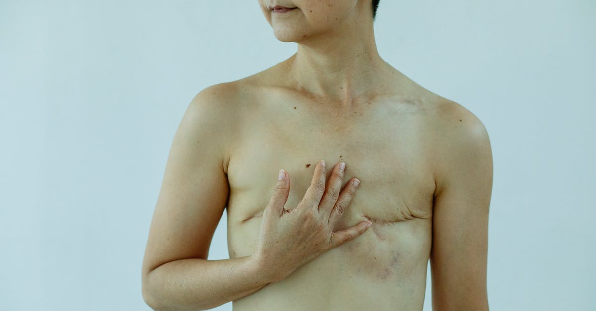 Will I get the trophy if I defeat the ender dragon on peaceful? - Crop anonymous female touching breast with scars after operation on white background of studio