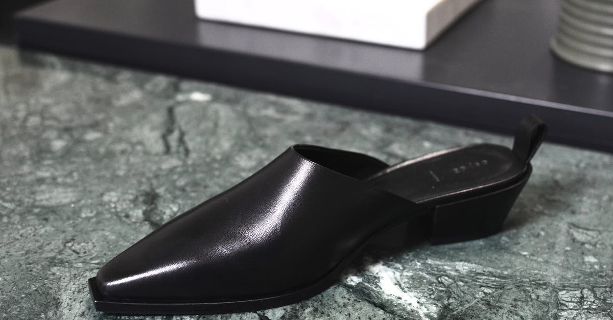Will I have to buy a new clan? - Stylish shiny shoe on marble surface