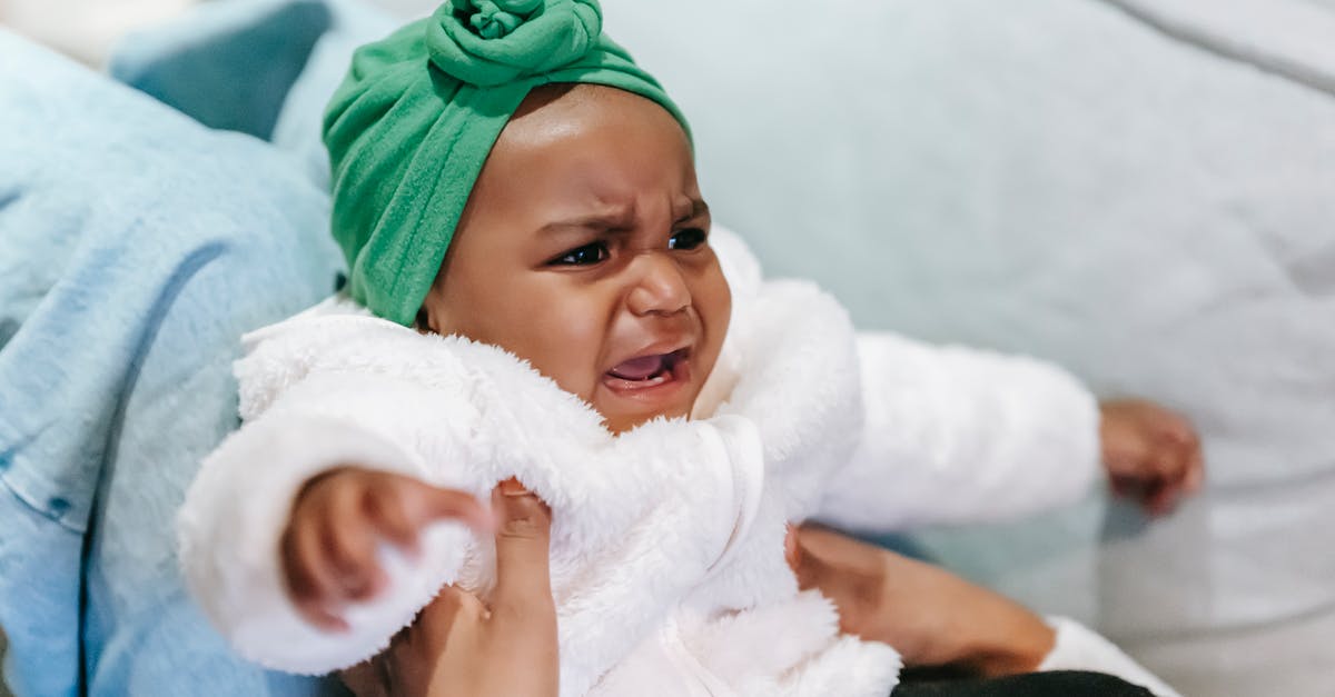 Will leaving corpses lying around upset my prisoners? - Crying black baby in turban in mother hands Will leaving corpses lying around upset my prisoners? - Crying black baby in turban in mother hands