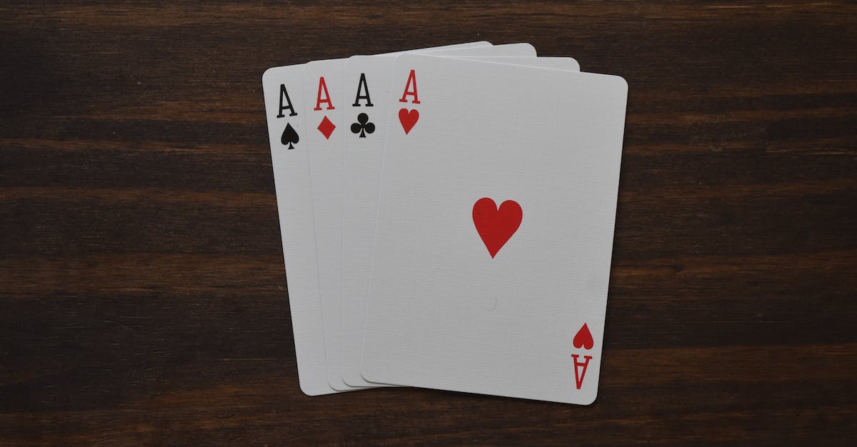 Will multiplayer games in Magic 2015 unlock cards? - Top view of combination of four aces of different suits in poker on wooden table