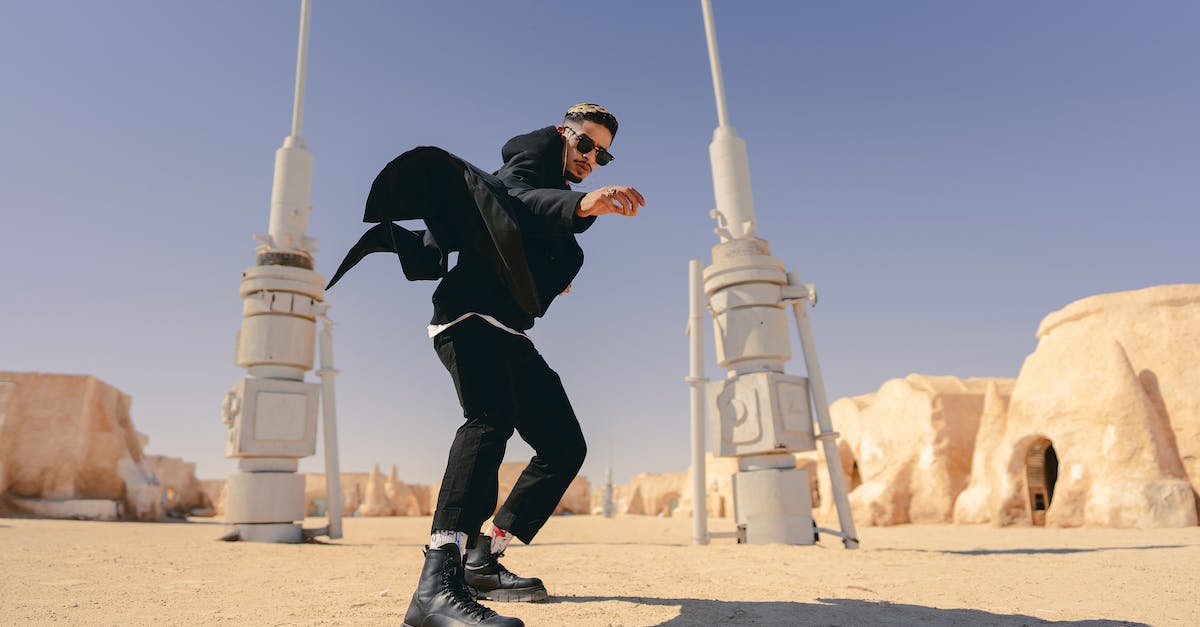 Will My Archer Tower Defend In Clan War During Their Upgradation? [duplicate] - Man Between Star Wars Style Towers on Desert