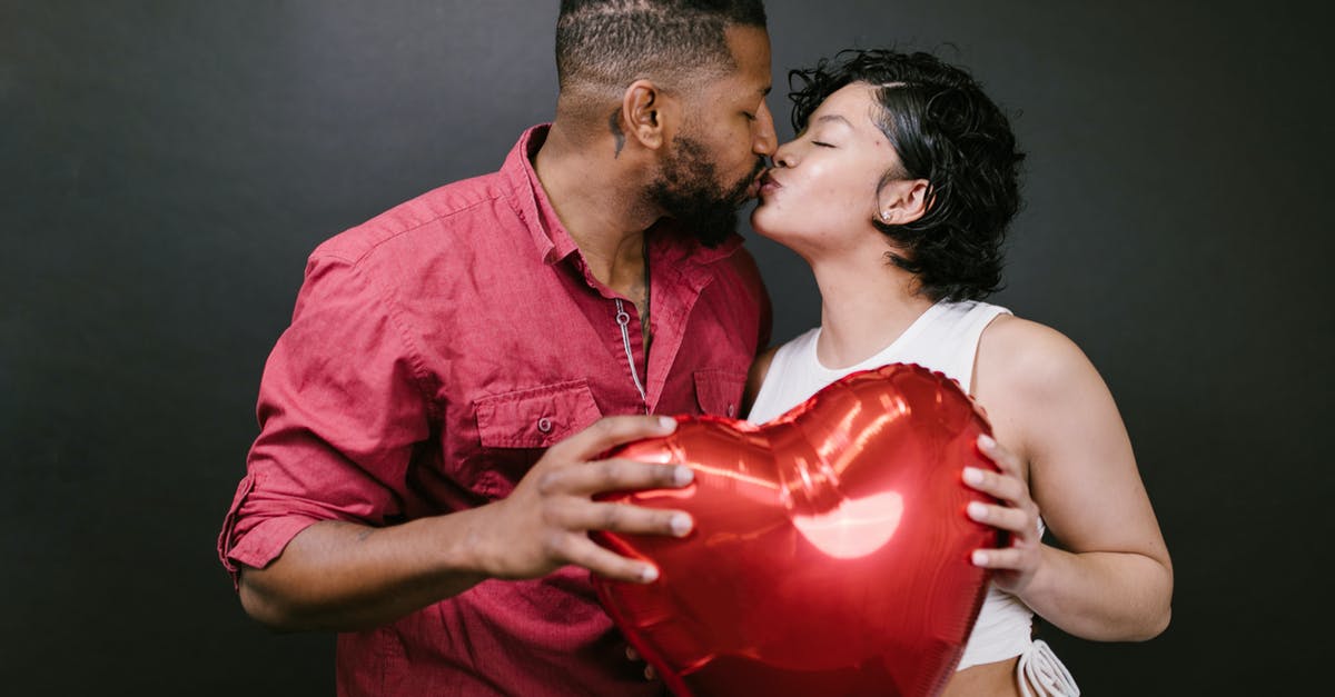 Will my explorer's happiness level affect his quest? - Couple Kissing While Holding a Red Heart Shaped Balloon