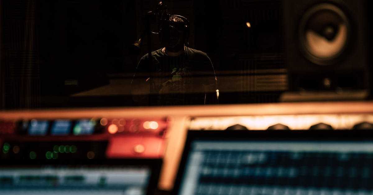Will my headphone's microphone still work if I'm passing it through a USB-C to 3.5mm stereo cable? [closed] - Man recording song in music studio