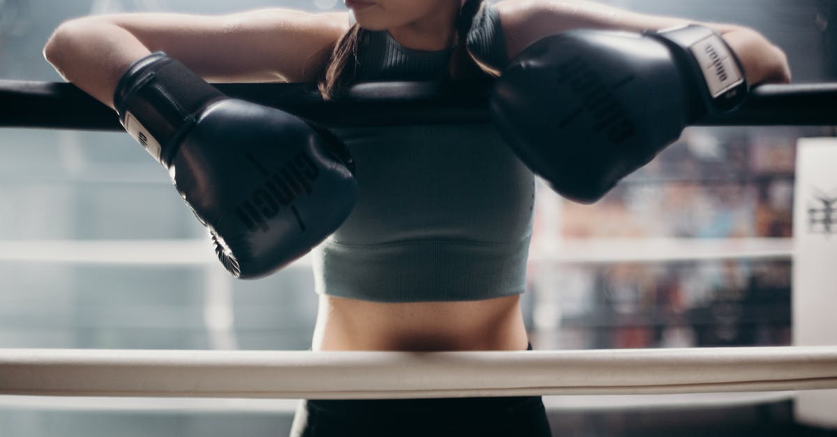 Will my own items' active make my champion cancel my current spell? - Woman in Black Sports Bra and Black Shorts Holding Black and White Boxing Gloves