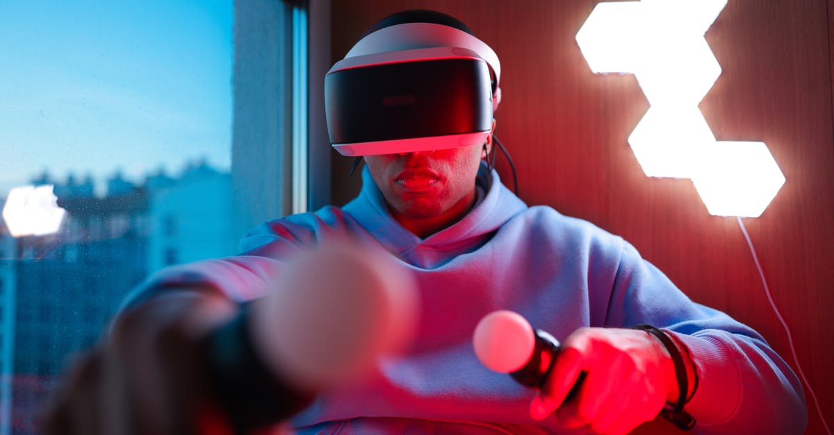 Will Oculus controllers work on PS3? - Man in Gray Hoodie Wearing Red Helmet