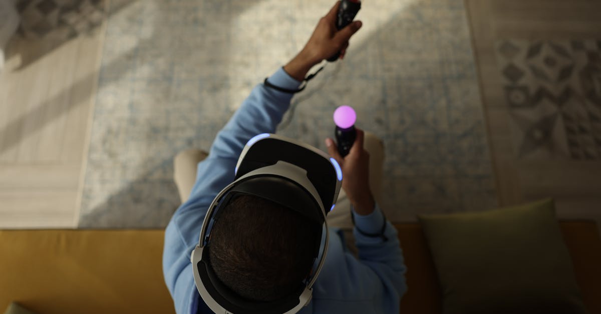 Will Oculus controllers work on PS3? - Person in Blue Long Sleeve Shirt Holding Purple Ball