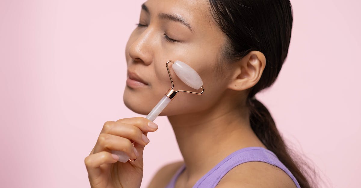 Will replacing the default player skin interfere with my premium profile skin? - Woman in Purple Tank Top Using A Facial Roller Will replacing the default player skin interfere with my premium profile skin? - Woman in Purple Tank Top Using A Facial Roller
