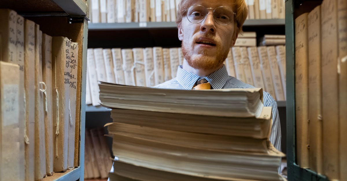 Will Skyrim work properly if mods and main files are split over two HDDs? - A Man Carrying a Pile of Documents