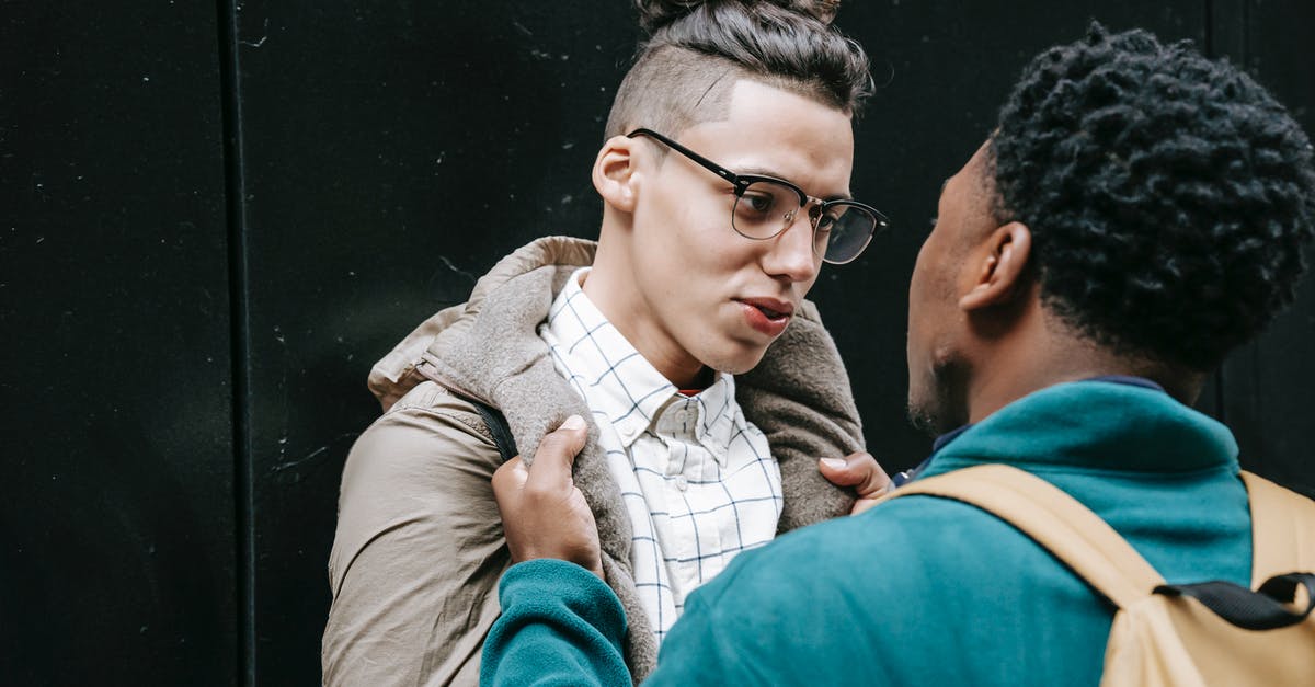 Will Snitches attack each other? - Young multiracial male millennials in stylish clothes fighting together on street and looking at each other