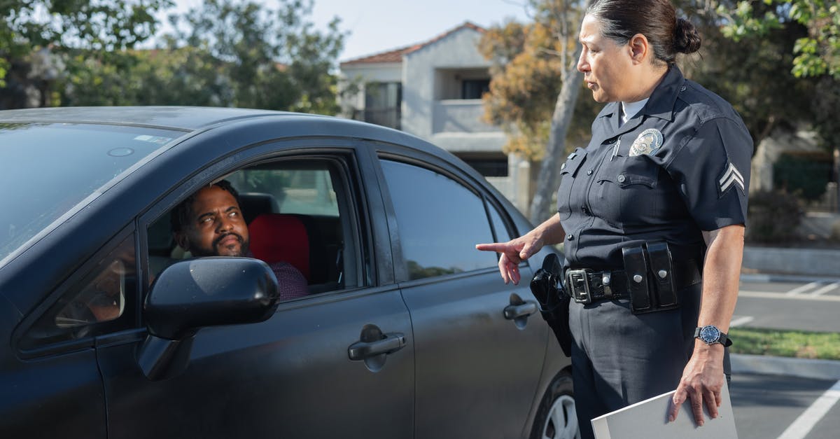 Will speeding ever have consequences? - Policewoman Talking to a Man Riding in a Car Will speeding ever have consequences? - Policewoman Talking to a Man Riding in a Car