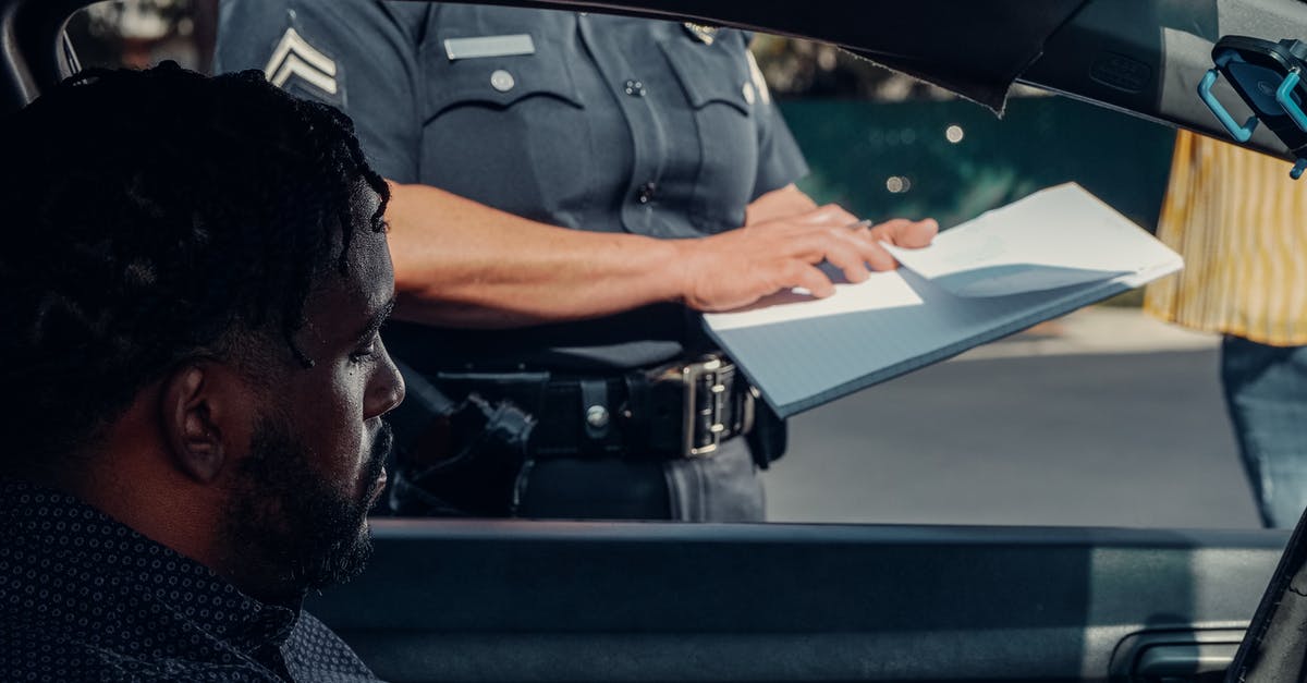 Will speeding ever have consequences? - Police Officer Standing Next to the Car Window Will speeding ever have consequences? - Police Officer Standing Next to the Car Window