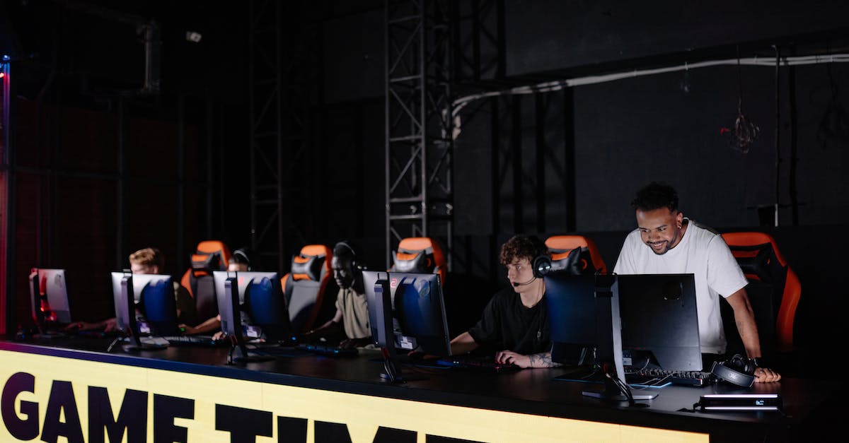 Will steam workshop download mods while playing a game? - People Sitting on Chair in Front of Table