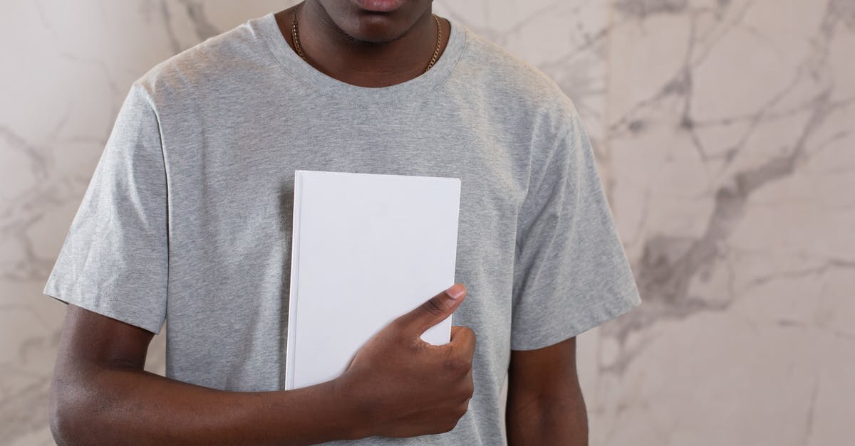 Will the journal show when I overtake gyms? - Crop black man with mock up notebook Will the journal show when I overtake gyms? - Crop black man with mock up notebook