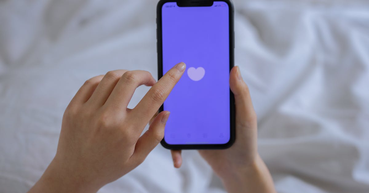 Will using a screen protector affect my 3ds xl touch screen? - Person Using Cellphone in Bed