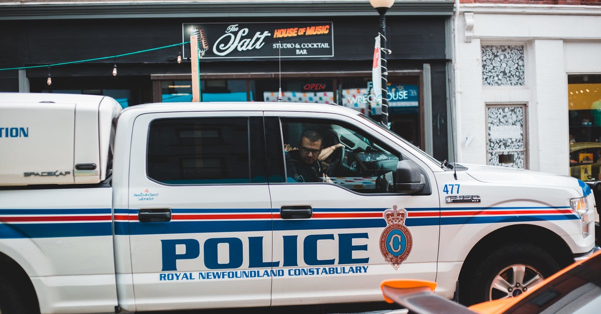 Will you be labeled a warmonger if keep recapturing an enemy city? - Policeman sitting in police car driving on street