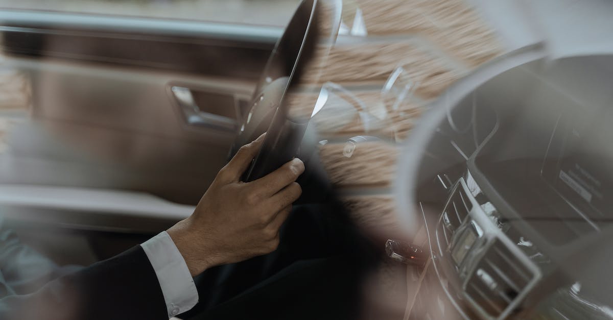 Windows 10 Video Driver Out-dated - Person in Black Suit Holding Smartphone