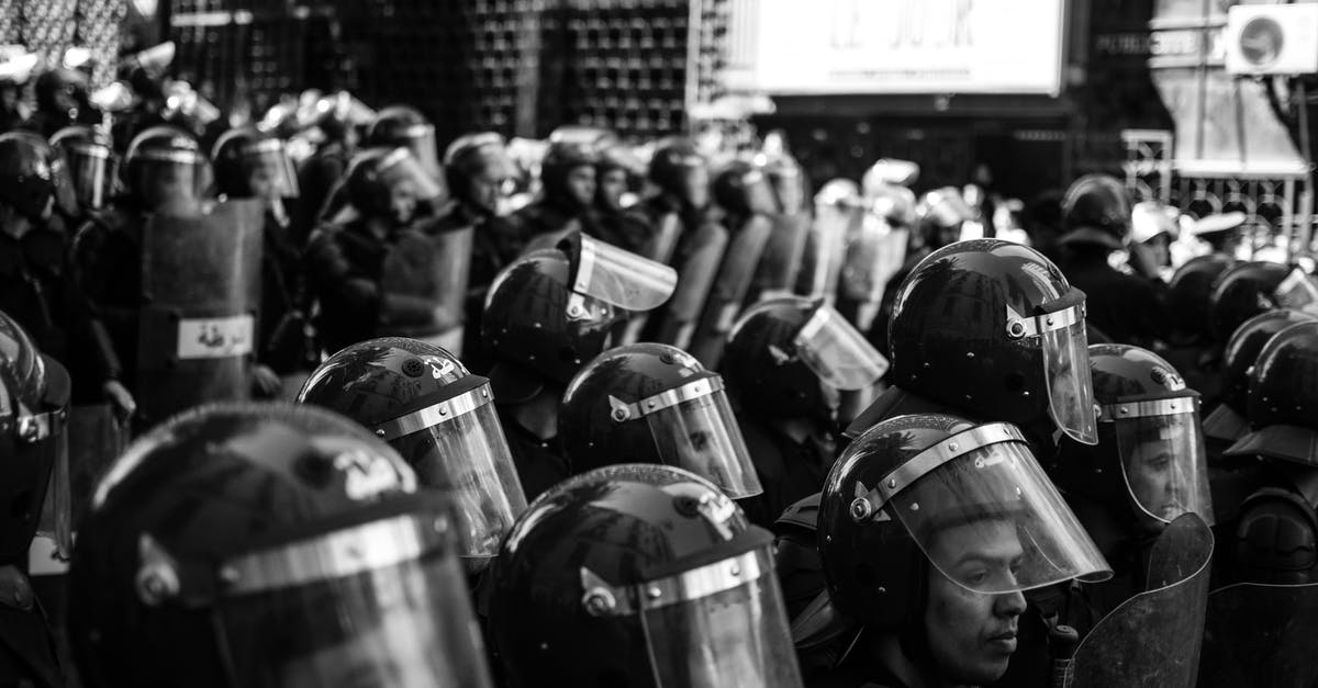 WindSpeaker's blessing and all these (maybe) shields - Grayscale Photo of People with Shields and Helmets 