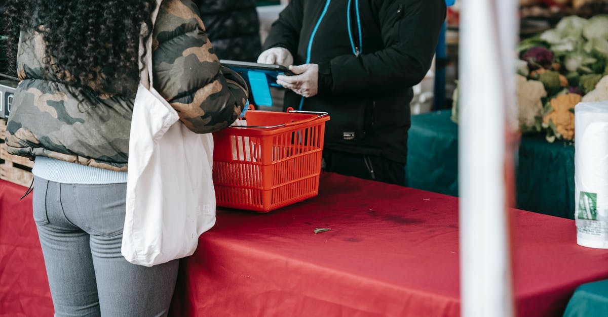 Windstride cost calculation - Customer and seller in protective gloves in food market