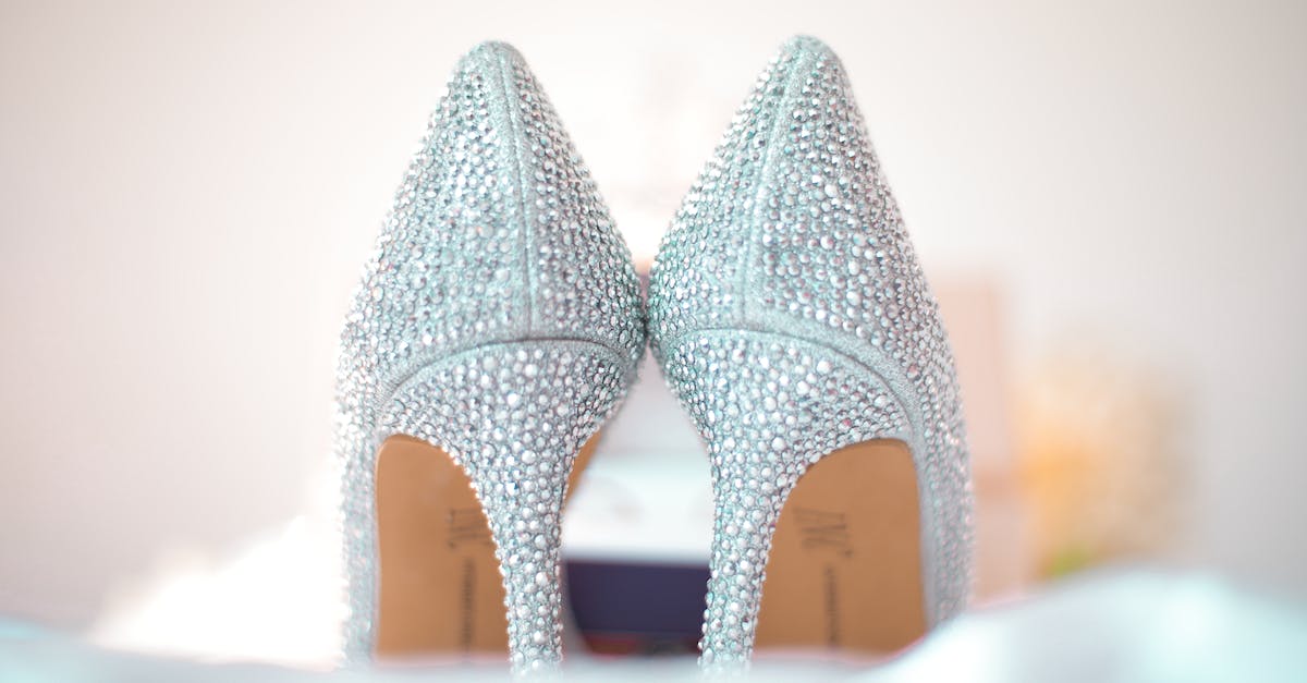 WoD: Assault on XXX Apexis Crystal events - Stylish wedding high heels decorated with shiny silver rhinestones placed on white fabric
