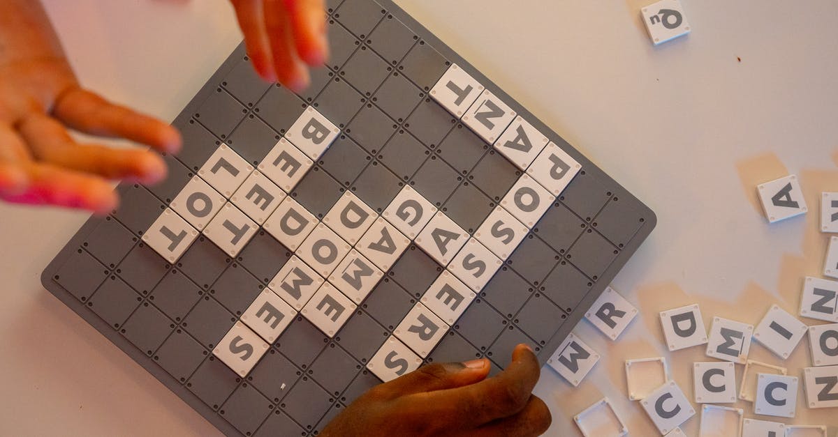 Words with friends - playing with “ the Masters” - Scrabble Tiles on Board