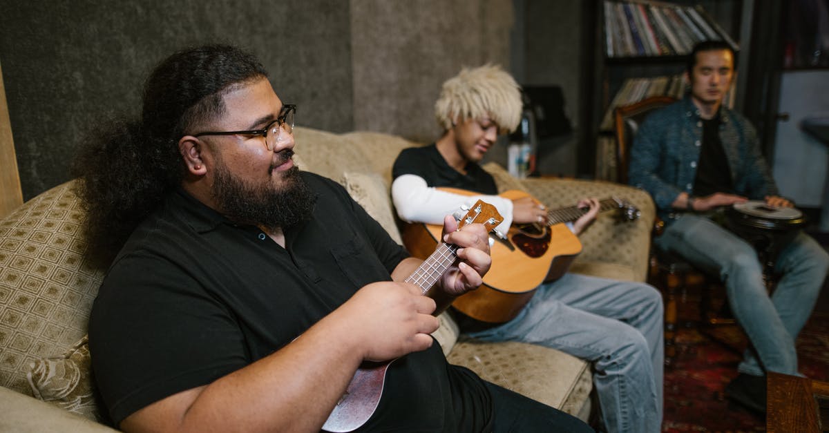 Words with friends - playing with “ the Masters” - Man in Black Crew Neck T-shirt Playing Brown Acoustic Guitar Words with friends - playing with “ the Masters” - Man in Black Crew Neck T-shirt Playing Brown Acoustic Guitar