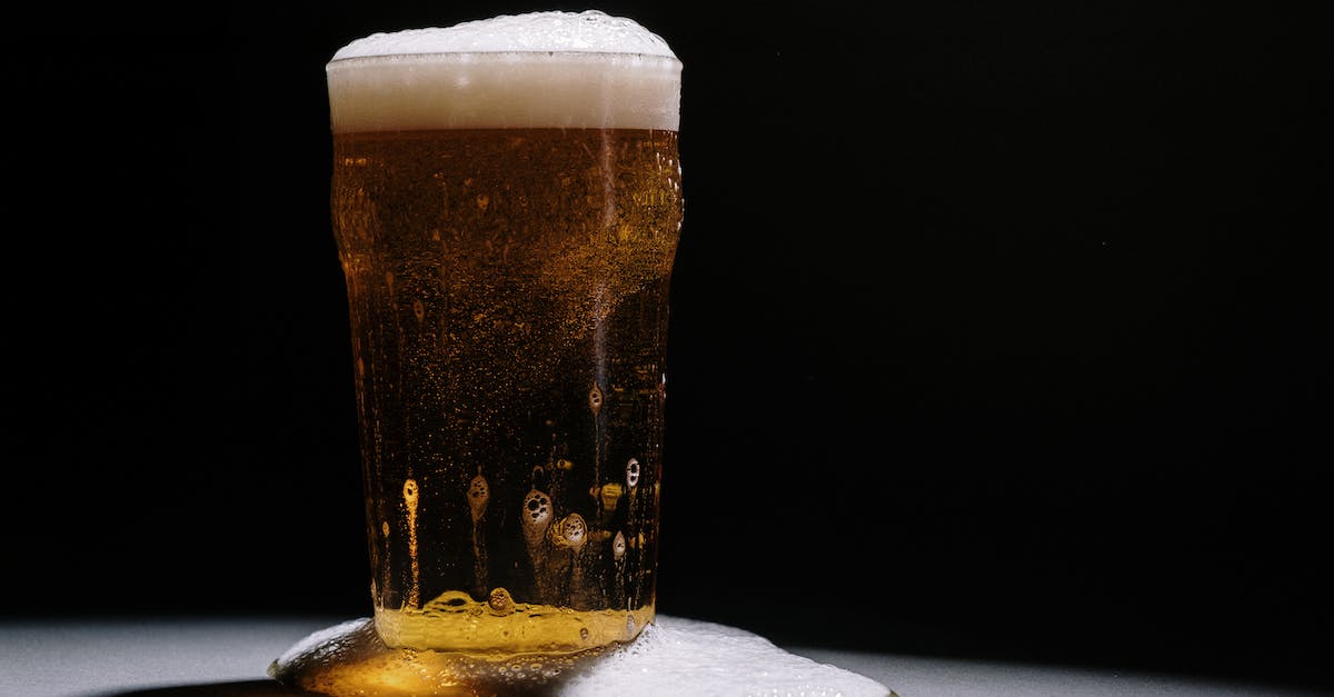 Would it overflow? - A Clear Drinking Glass With Beer Would it overflow? - A Clear Drinking Glass With Beer