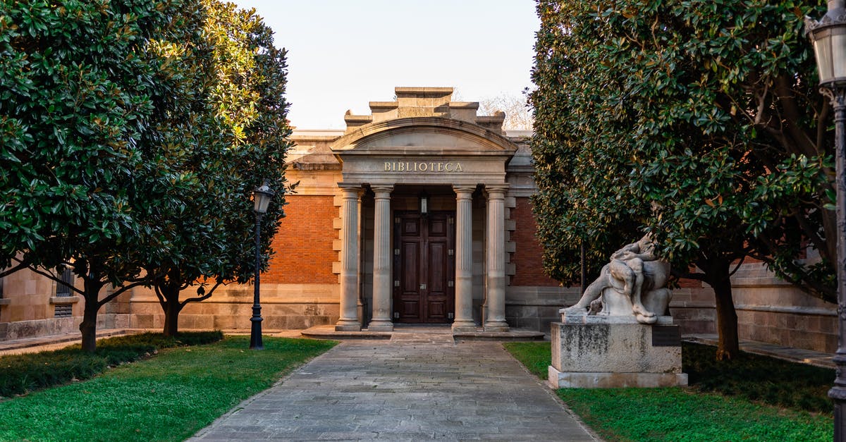 Would the gate in Path of Pain stay open if i saved and quit? - Facade of old library with high columns with walkway and statue in green park in Spain