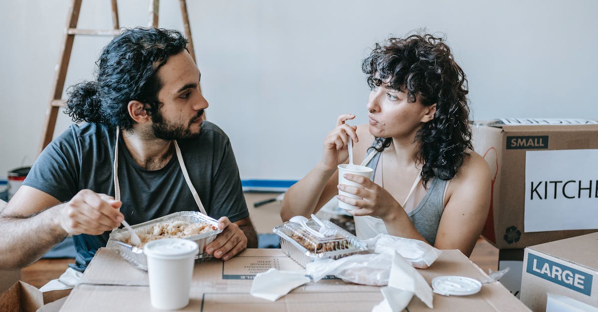 WoW - why improve Inscription after 600? - Ethnic couple interacting during lunch after moving in house