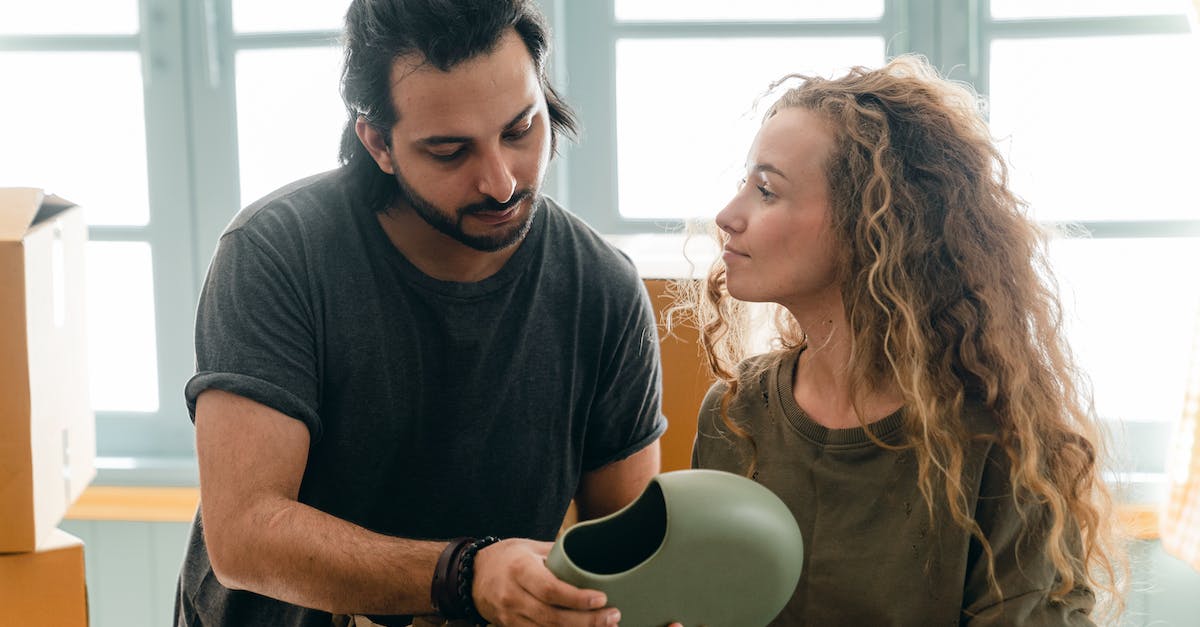 Wow expansion pack help - Young focused spouses discussing while preparing for relocation Wow expansion pack help - Young focused spouses discussing while preparing for relocation