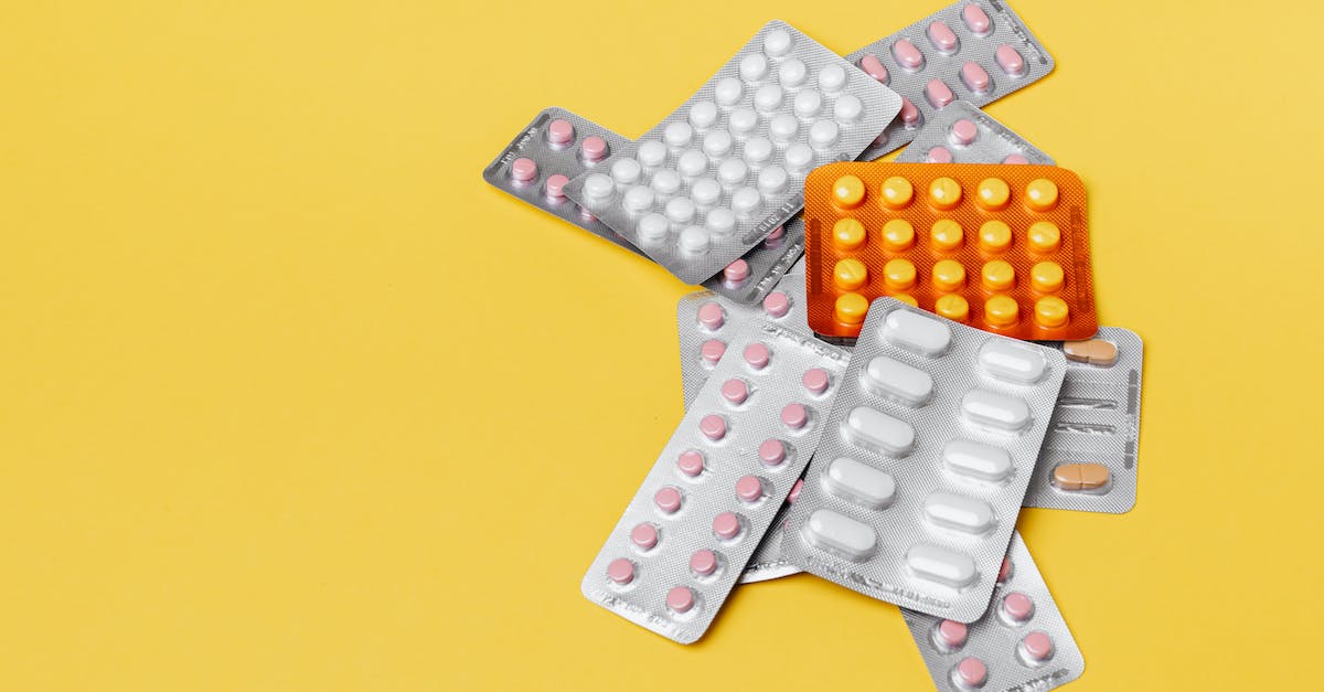 Wow expansion pack help - Heap of various pills in blisters on yellow background Wow expansion pack help - Heap of various pills in blisters on yellow background