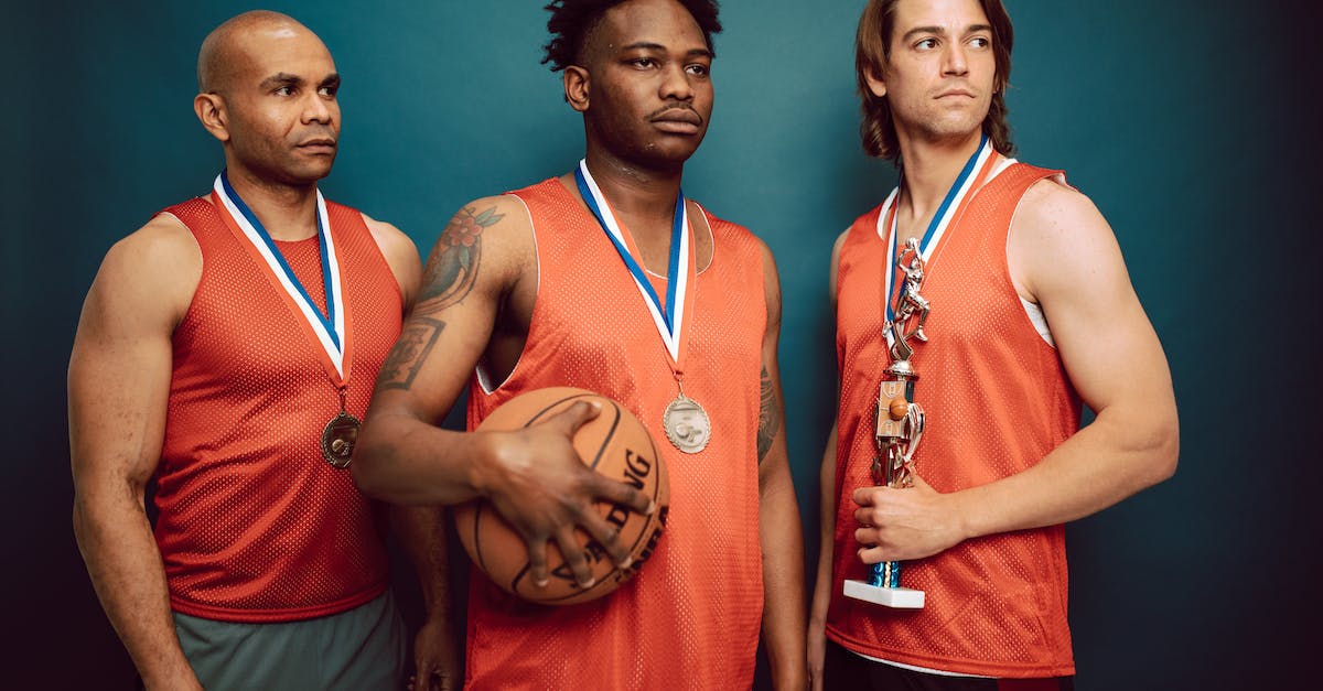 XBox 360 - NBA 2K13 MyCareer: Which achievements still work? - Three Men Wearing Medals in Orange Jersey Holding a Basketball and Trophy XBox 360 - NBA 2K13 MyCareer: Which achievements still work? - Three Men Wearing Medals in Orange Jersey Holding a Basketball and Trophy